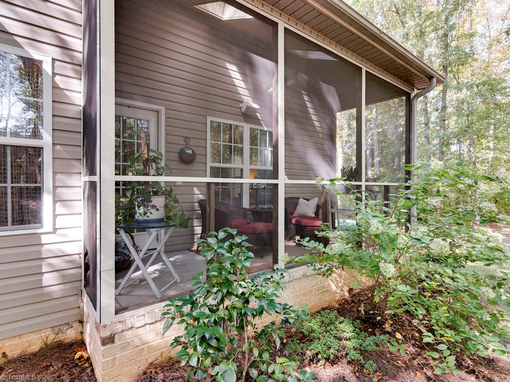 7070 Lanier Road Summerfield, NC 27358 - Photo 14 of 27 Owner's Porch off of the Master Bedroom has surround sound and skylights