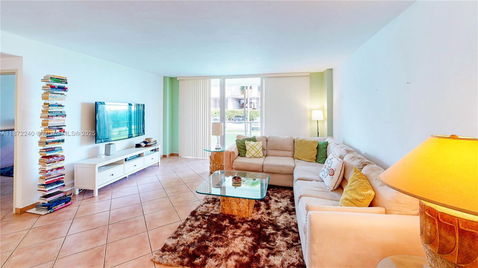 3301 Northeast 5th Avenue, Unit 110 Miami, FL 33137 - Photo 11 of 87 a living room with furniture and a flat screen tv