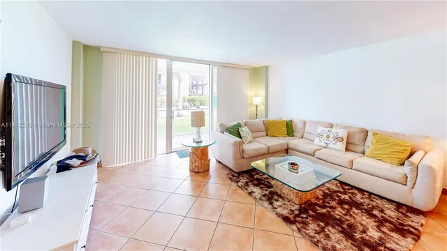 a living room with furniture and a lamp