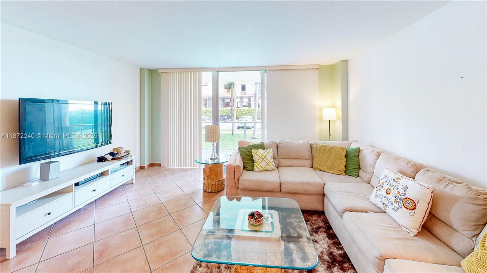 3301 Northeast 5th Avenue, Unit 110 Miami, FL 33137 - Photo 16 of 87 a living room with furniture and a flat screen tv