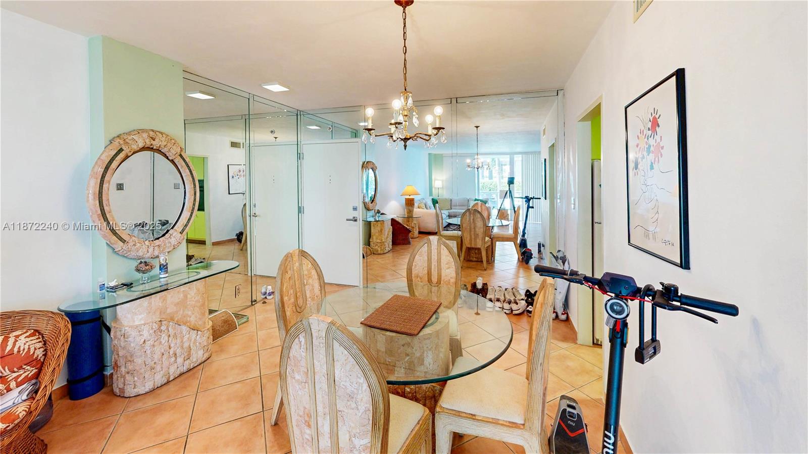 3301 Northeast 5th Avenue, Unit 110 Miami, FL 33137 - Photo 22 of 87 a view of a dining room with furniture and a chandelier