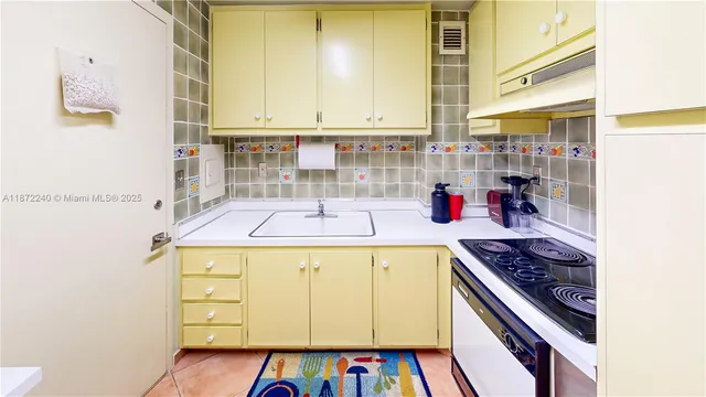 a very nice looking room with a large window and white walls