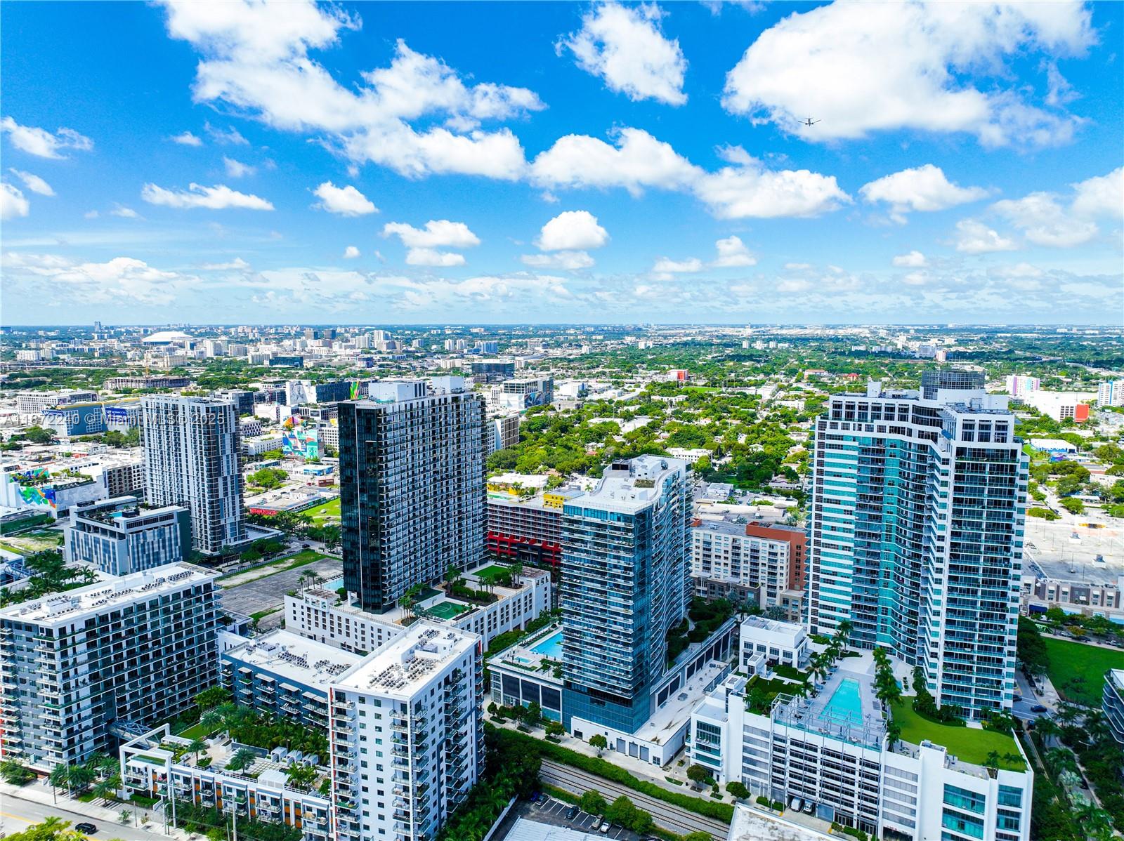 3301 Northeast 5th Avenue, Unit 110 Miami, FL 33137 - Photo 87 of 87 a view of a chairs and table in the city view