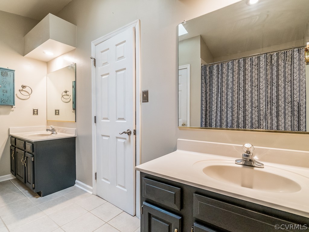 12324 Walkes Quarter Road Chesterfield, VA 23838 - Photo 20 of 34 a bathroom with a sink and a mirror