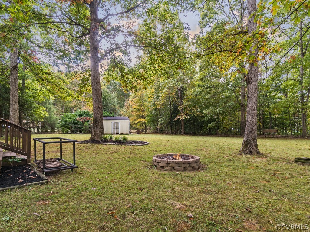 12324 Walkes Quarter Road Chesterfield, VA 23838 - Photo 34 of 34 a backyard of a house with table and chairs