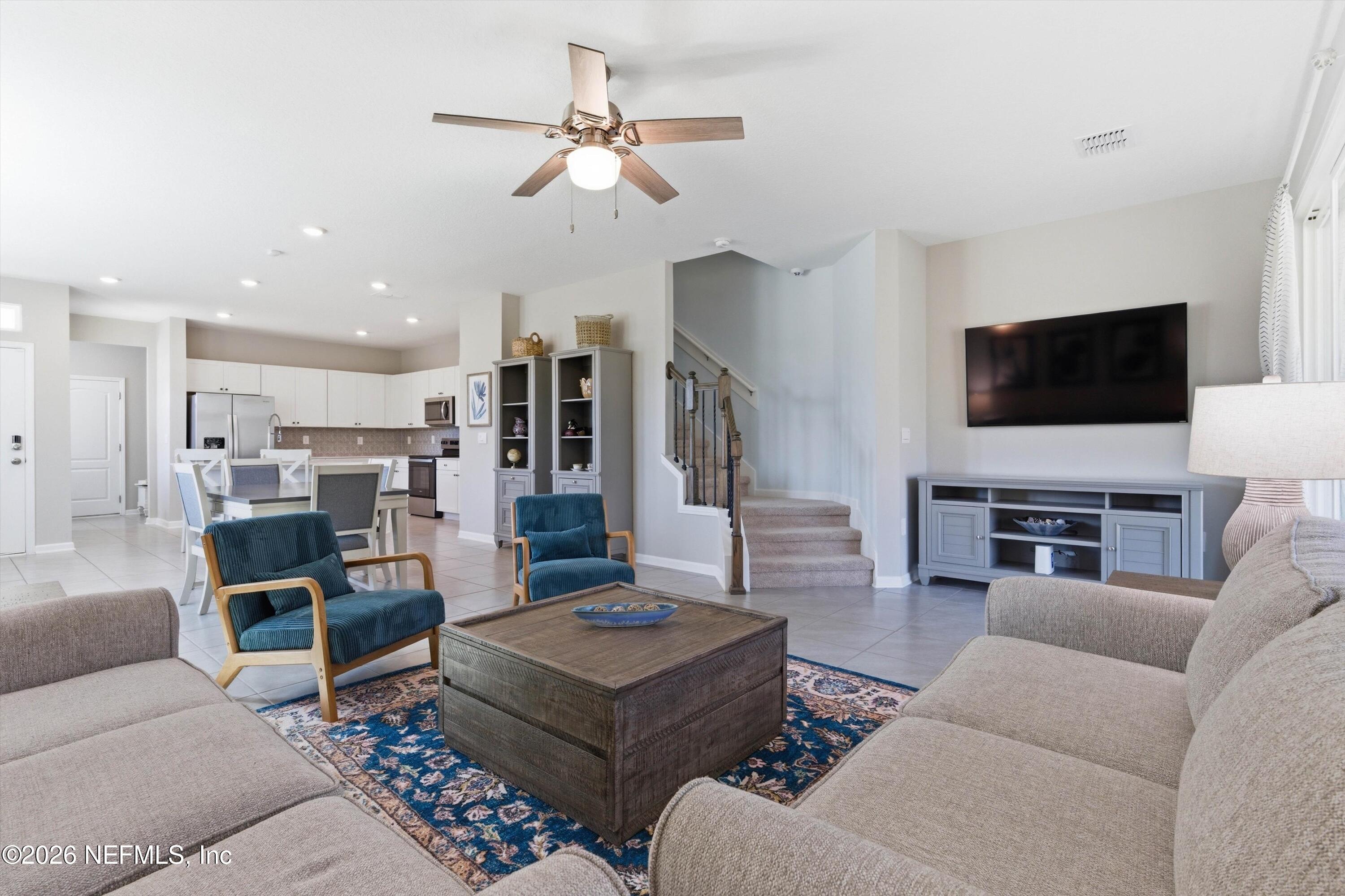 103 Seaport Breeze Road St. Augustine, FL 32095 - Photo 13 of 44 a living room with furniture and a flat screen tv