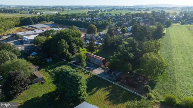 an aerial view of a golf course with green space