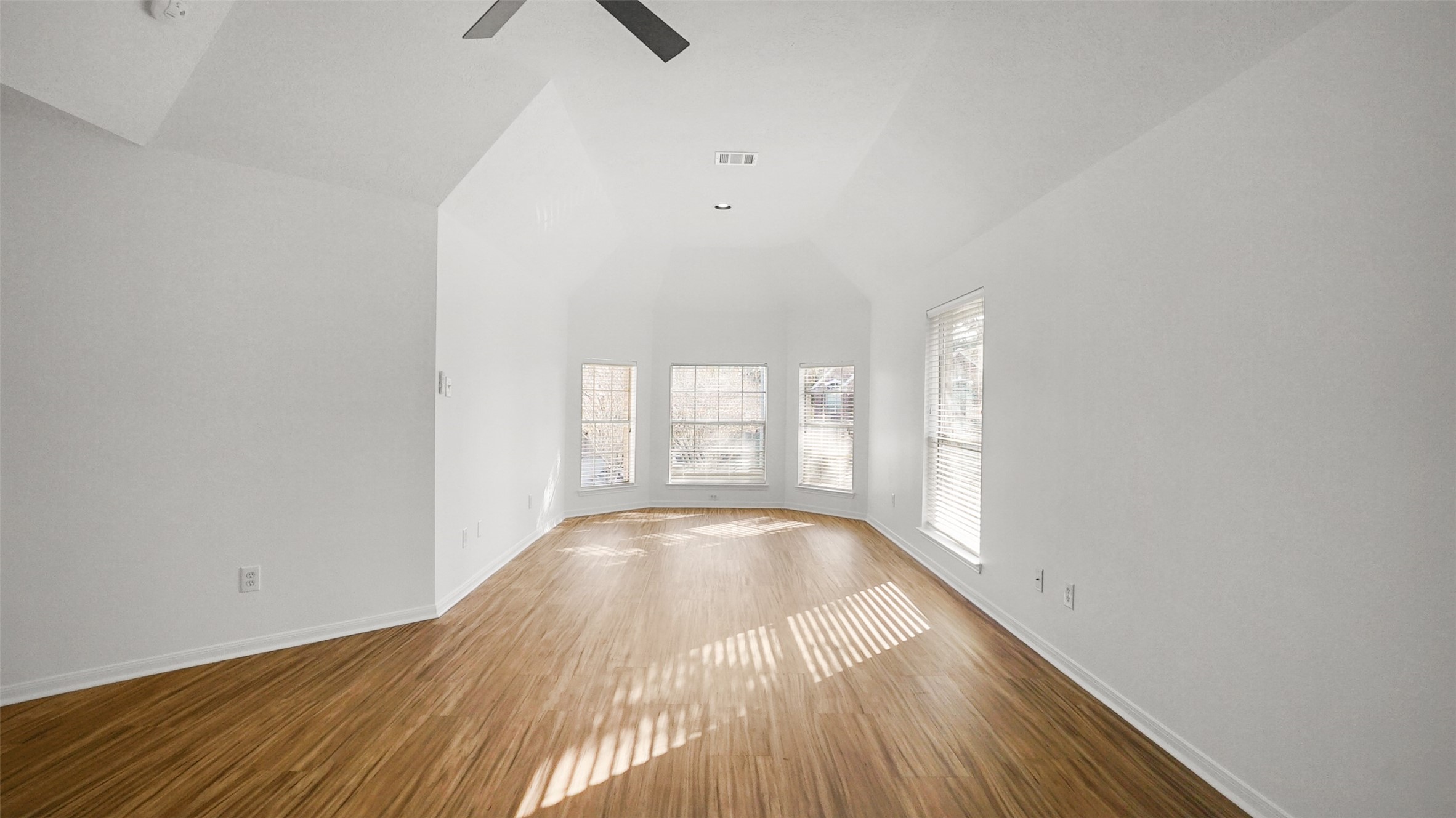 810 Flanners Court Spring, TX 77373 - Photo 22 of 42 a view of empty room with wooden floor and fan