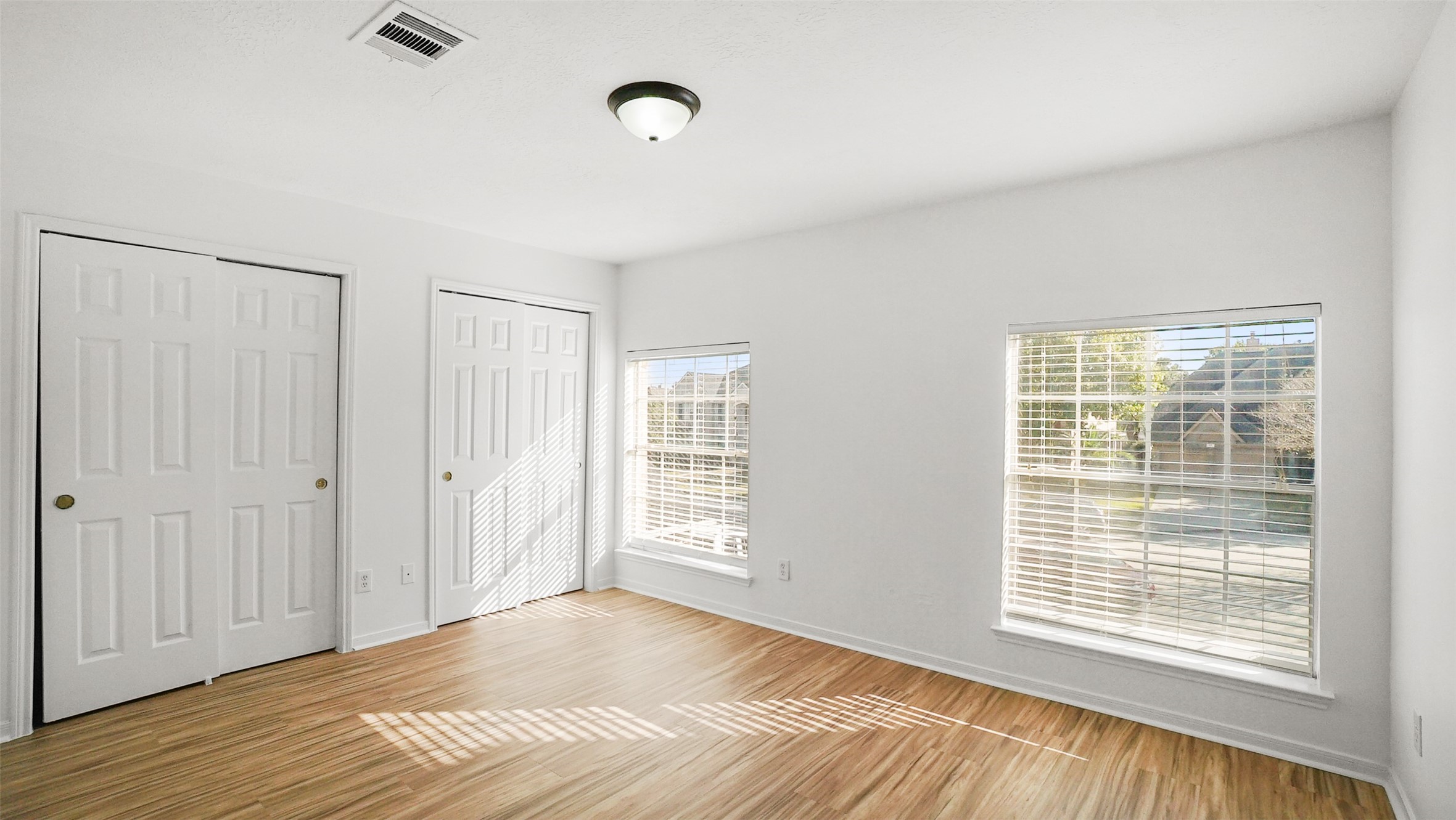 810 Flanners Court Spring, TX 77373 - Photo 28 of 42 a view of an empty room with wooden floor and a window