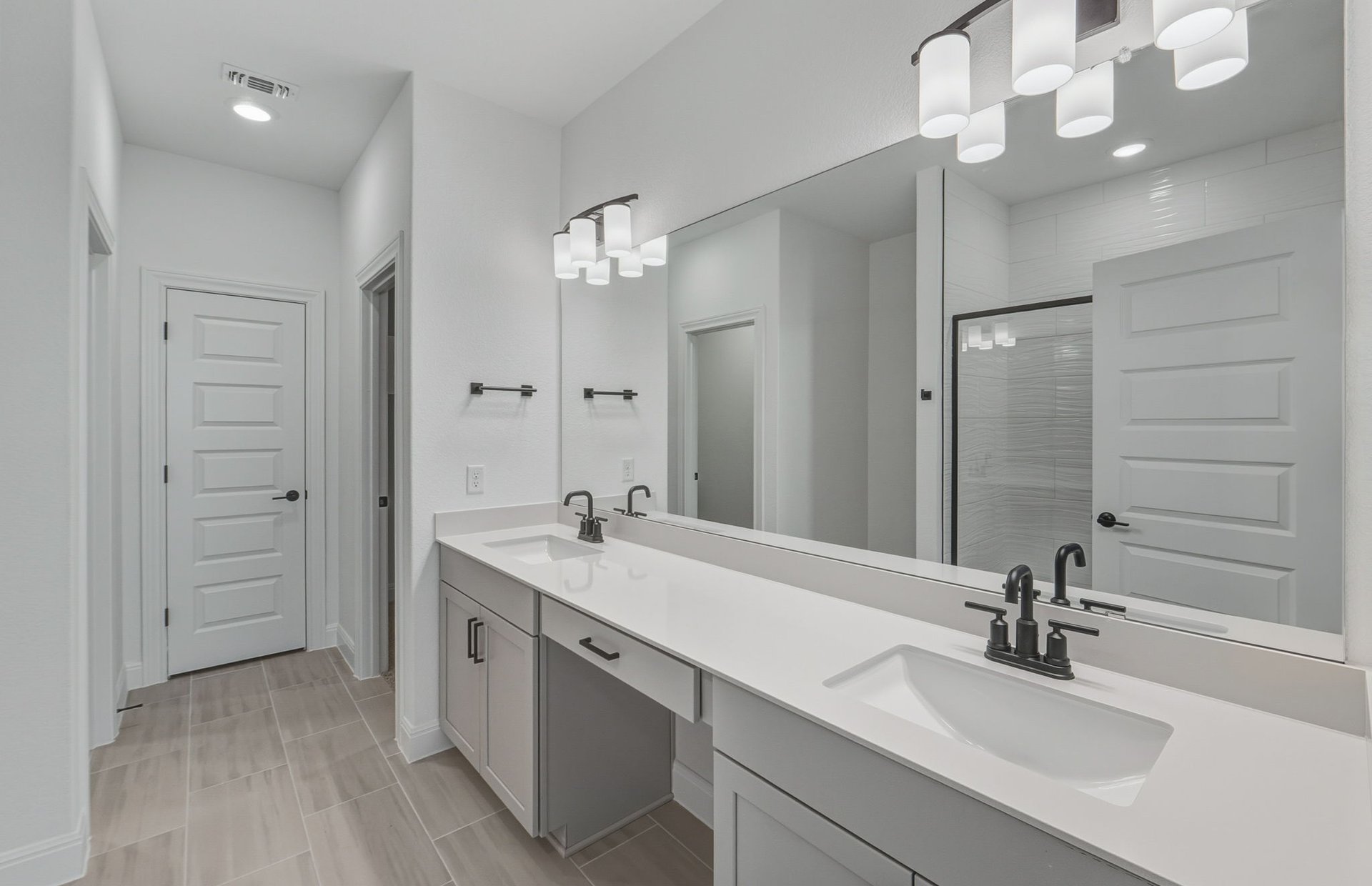 16800 Catemaco Walk Manor Manor, TX 78653 - Photo 9 of 26 a bathroom with a sink double vanity and a mirror