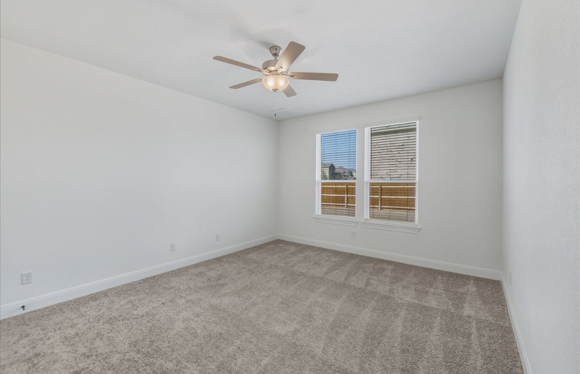 16800 Catemaco Walk Manor Manor, TX 78653 - Photo 10 of 26 an empty room with windows and fan