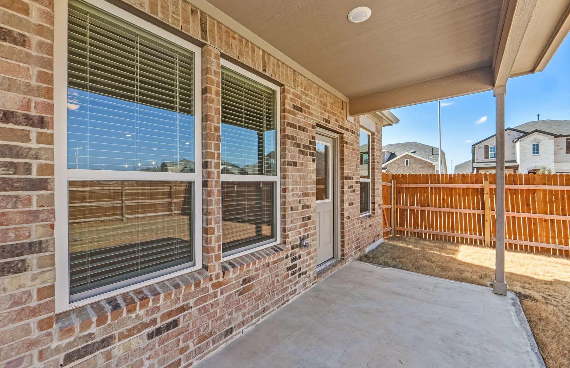 16800 Catemaco Walk Manor Manor, TX 78653 - Photo 23 of 26 a view of a house with a wooden fence