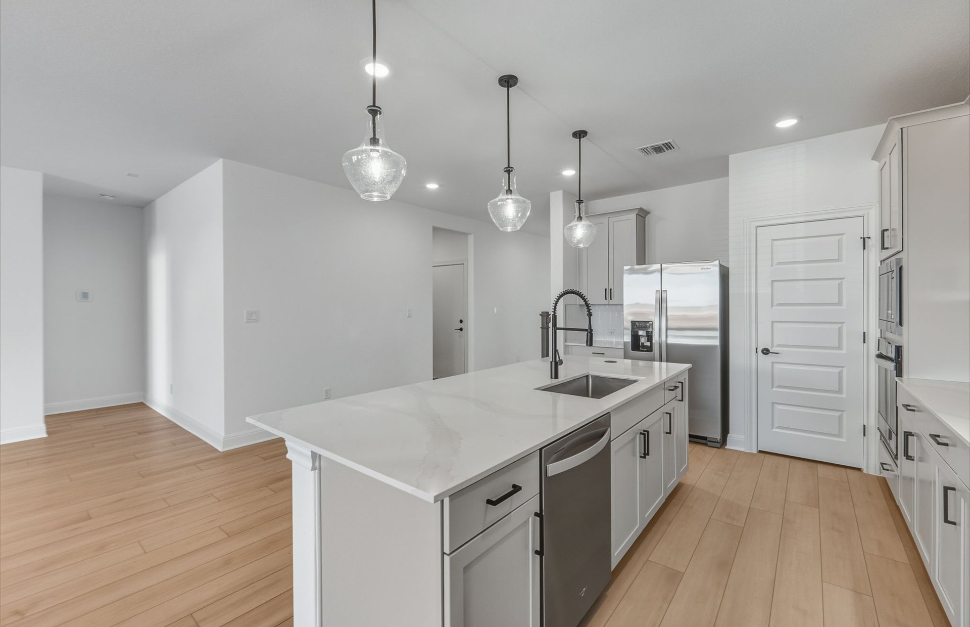16800 Catemaco Walk Manor Manor, TX 78653 - Photo 5 of 26 a kitchen with a sink a stove a refrigerator and a oven
