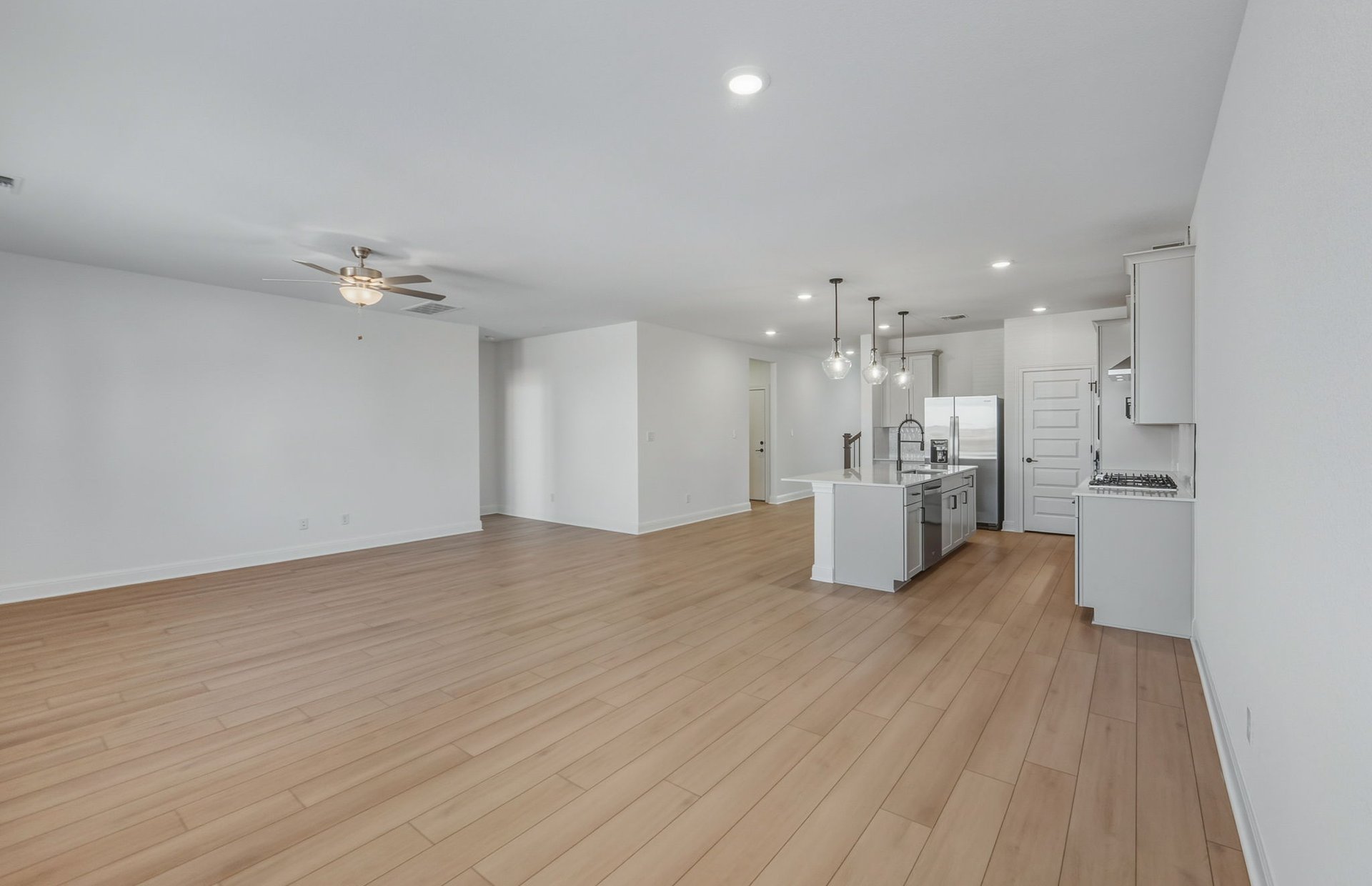 16800 Catemaco Walk Manor Manor, TX 78653 - Photo 6 of 26 a view of kitchen and hall with wooden floor