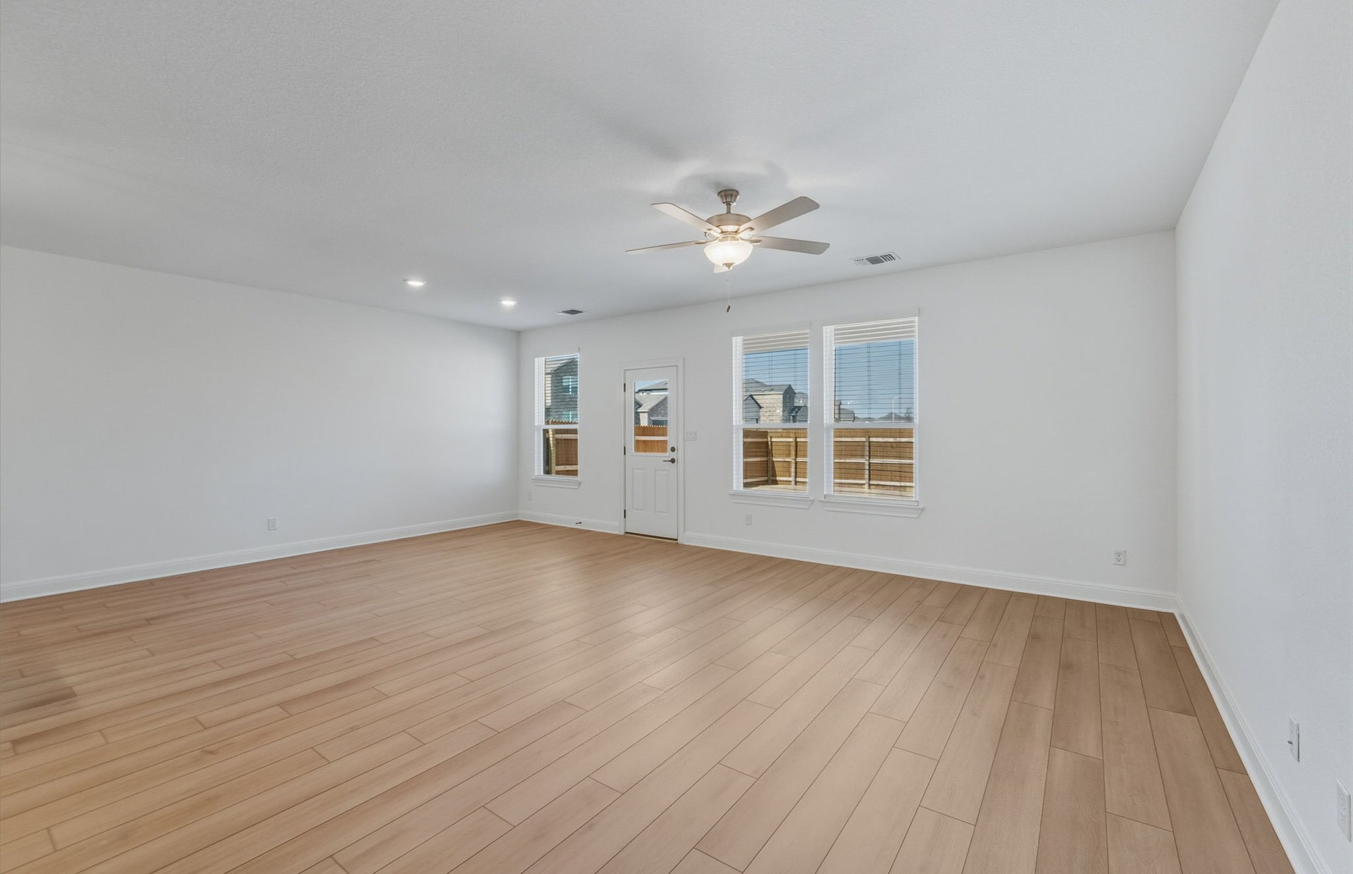 16800 Catemaco Walk Manor Manor, TX 78653 - Photo 7 of 26 a view of empty room with wooden floor and fan