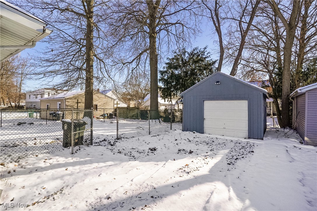 1618 Hampton Road Akron, OH 44305 - Photo 27 of 30 Yard layered in snow with a garage and an outdoor structure
