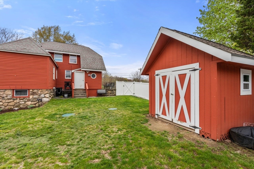 66 Bethany Road Framingham, MA 01702 - Photo 17 of 20 a front view of a house with garden