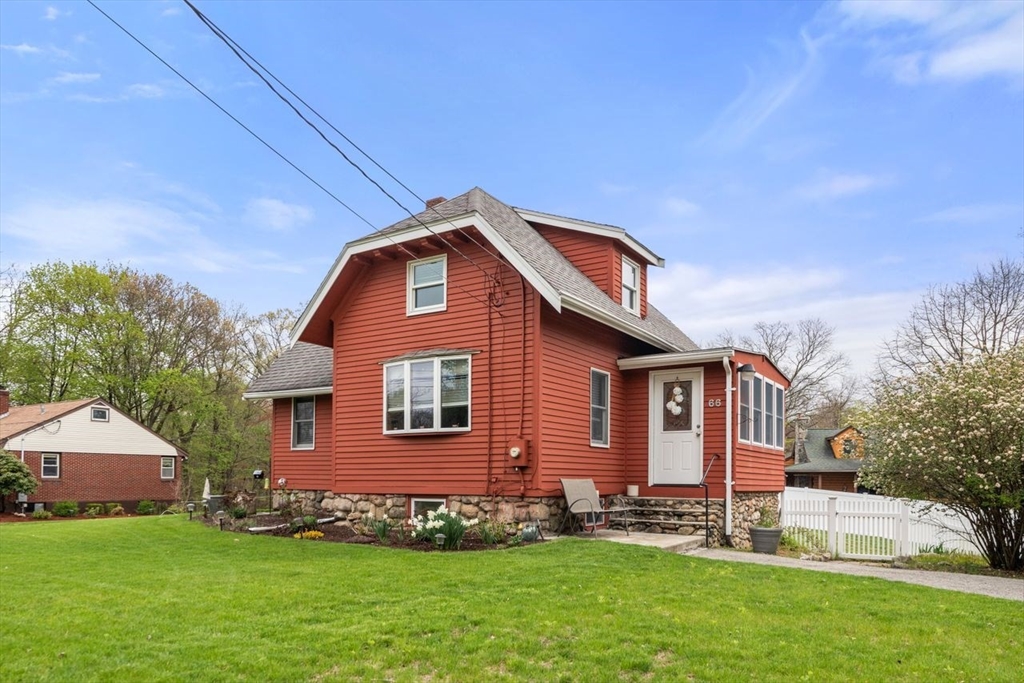66 Bethany Road Framingham, MA 01702 - Photo 20 of 20 a front view of a house with a garden
