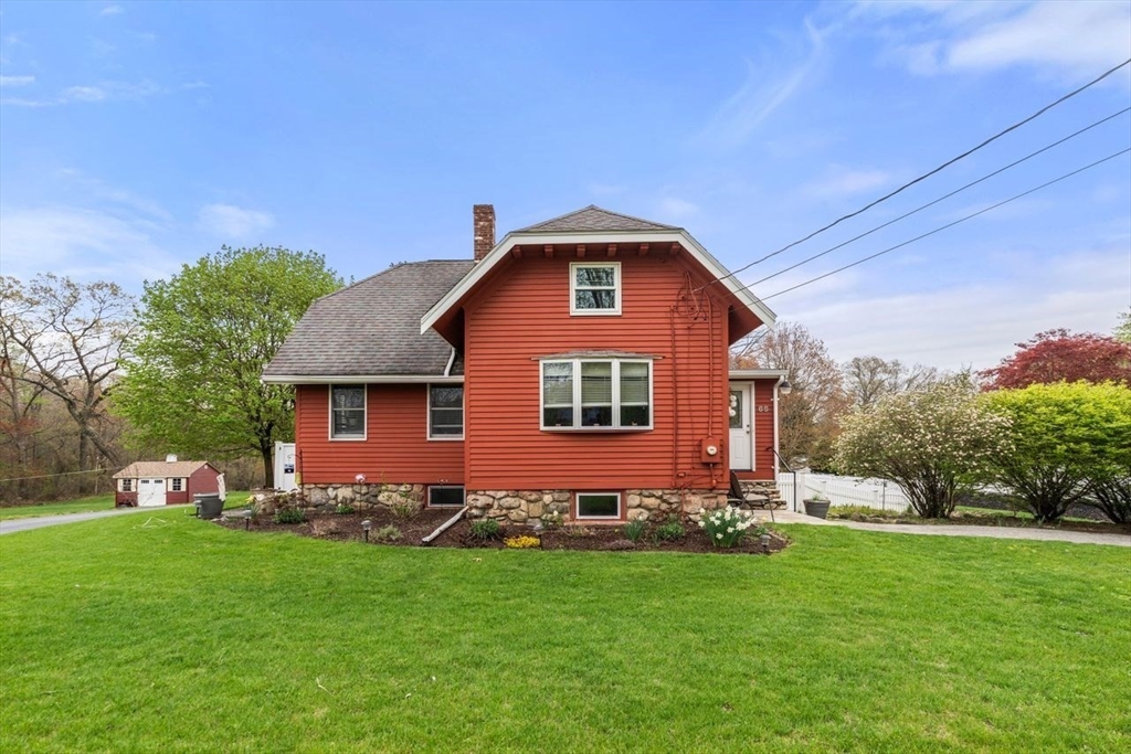 66 Bethany Road Framingham, MA 01702 - Photo 2 of 20 a front view of house with garden