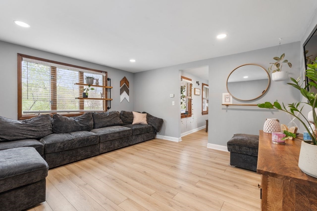 66 Bethany Road Framingham, MA 01702 - Photo 4 of 20 a living room with a couch and a large window