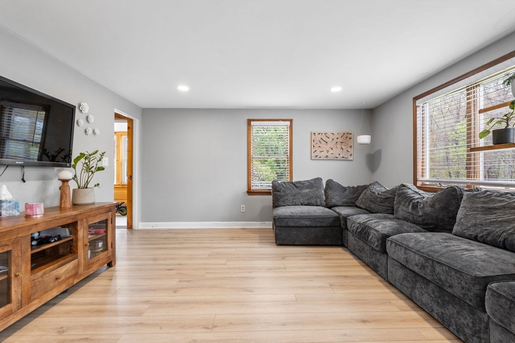 66 Bethany Road Framingham, MA 01702 - Photo 5 of 20 a living room with furniture and a flat screen tv