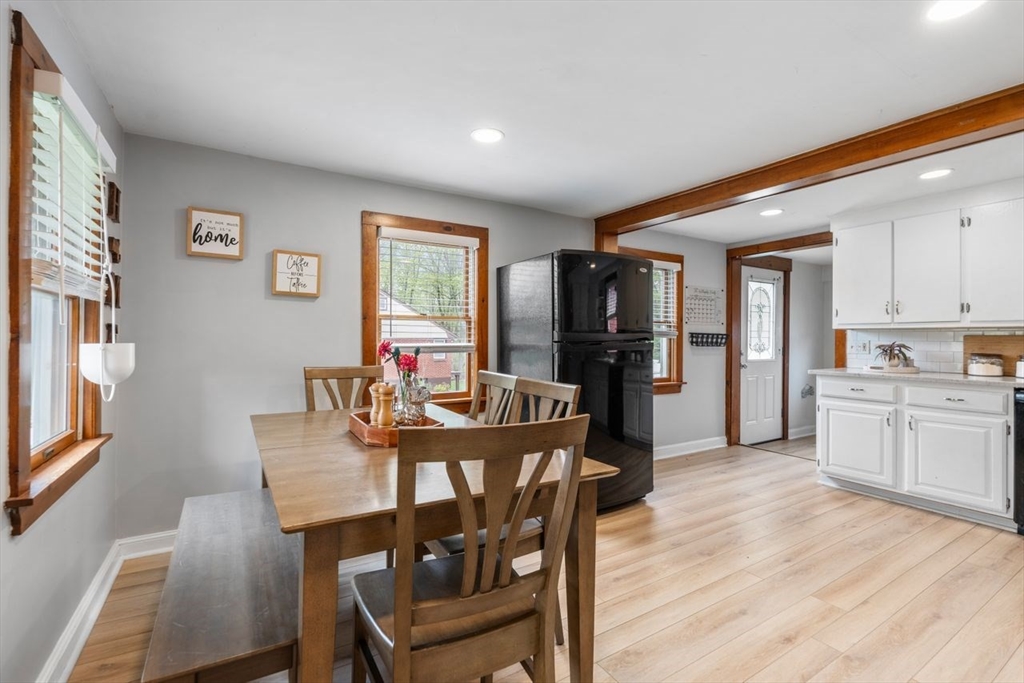 66 Bethany Road Framingham, MA 01702 - Photo 7 of 20 a view of a dining room with furniture and wooden floor