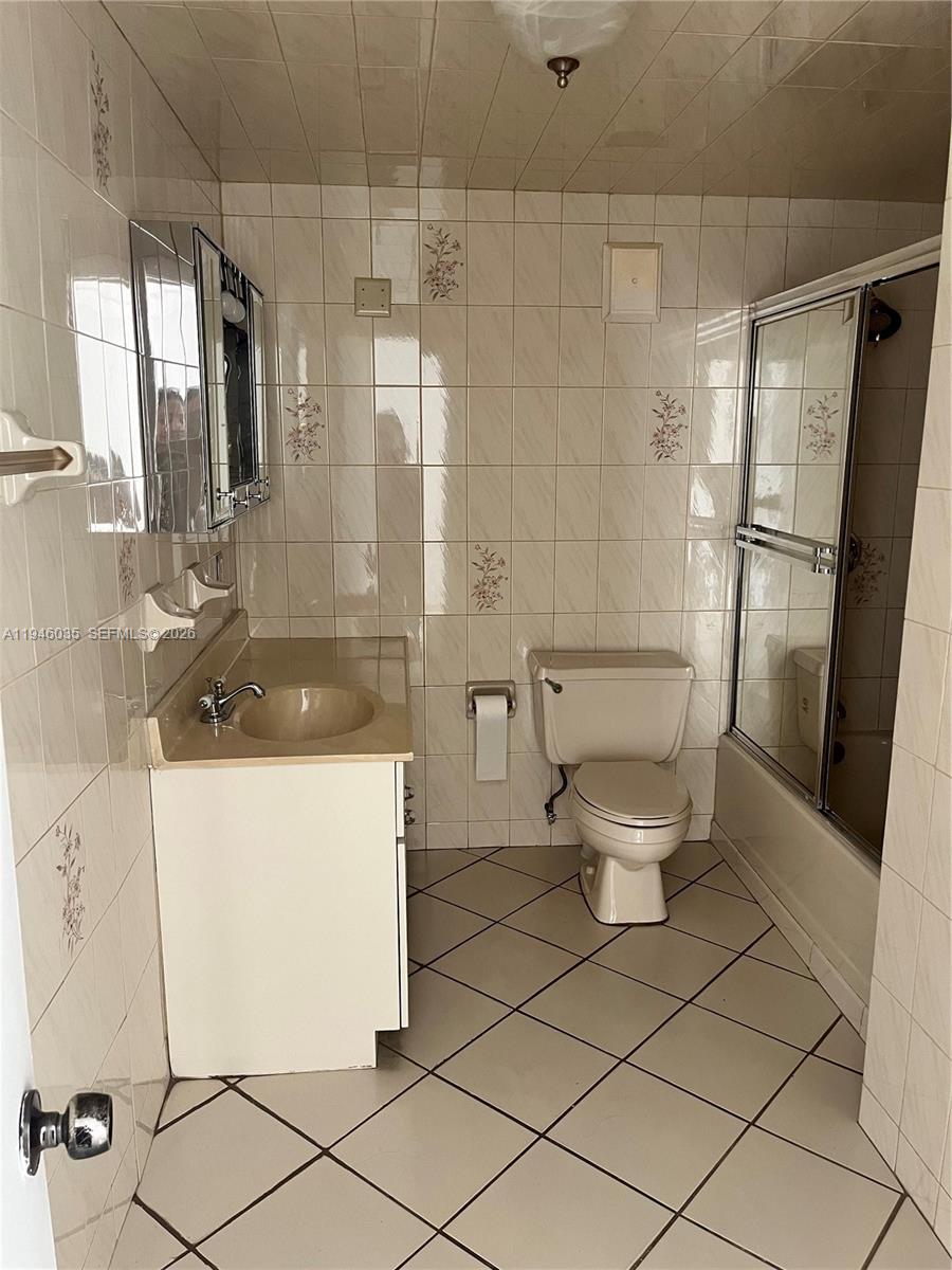 6780 West 2nd Court, Unit 408 Hialeah, FL 33012 - Photo 13 of 15 a bathroom with a sink toilet and shower