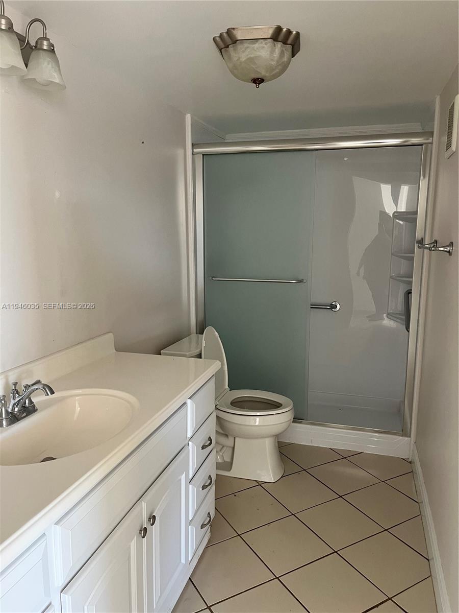 6780 West 2nd Court, Unit 408 Hialeah, FL 33012 - Photo 9 of 15 a bathroom with a sink and a mirror