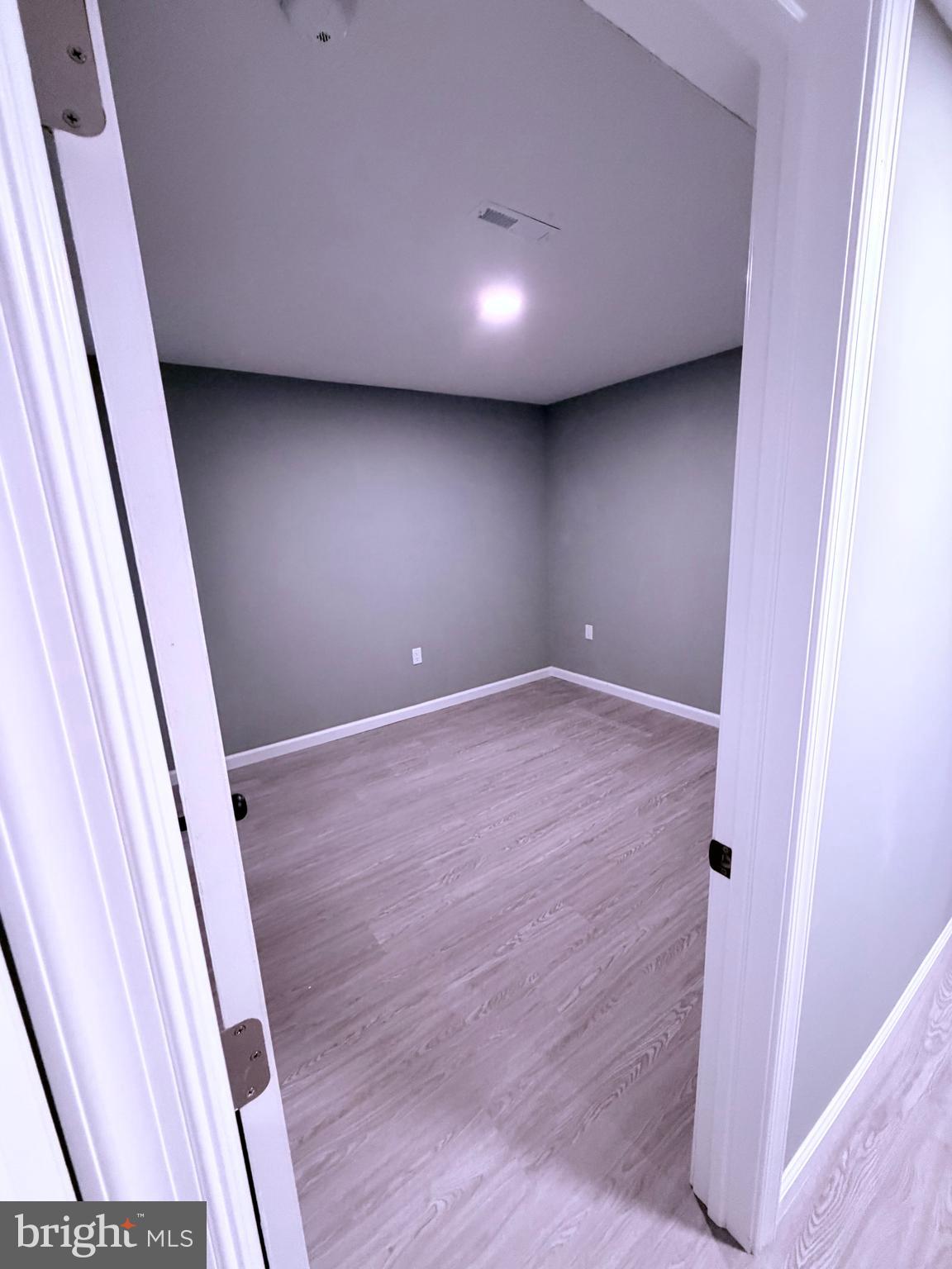 3507 Riviera Street Temple Hills, MD 20748 - Photo 13 of 16 a view of room with stairs and wooden floor