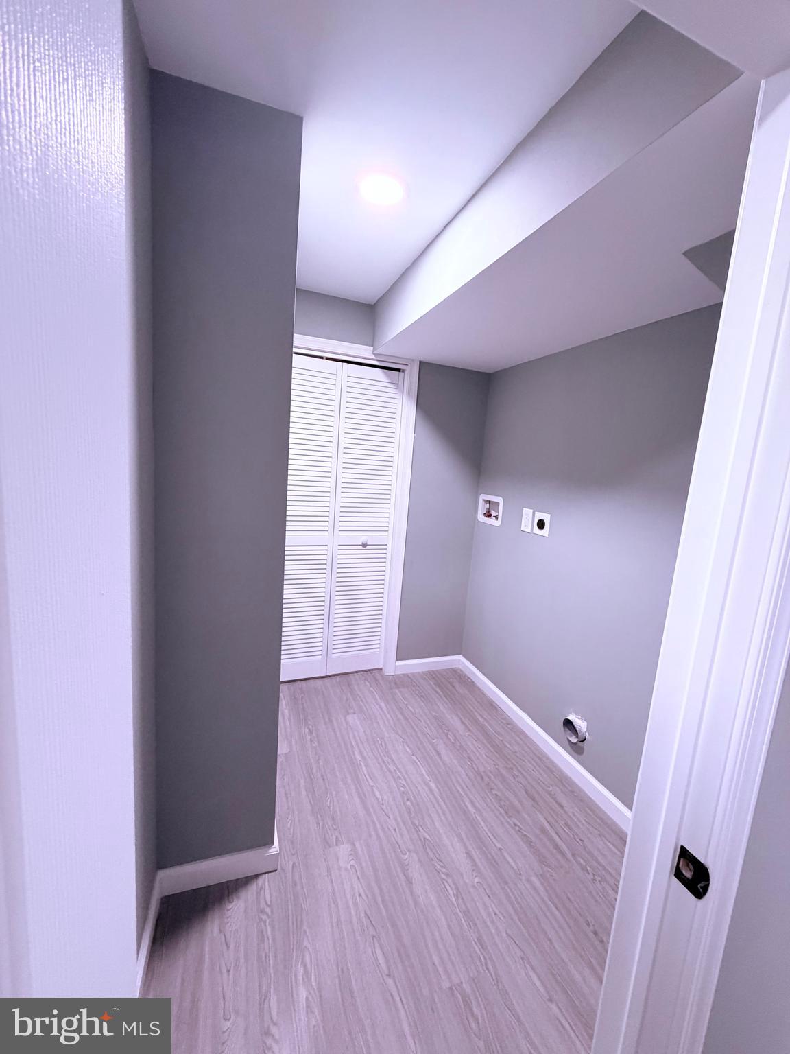 3507 Riviera Street Temple Hills, MD 20748 - Photo 14 of 16 a view of an empty room with wooden floor