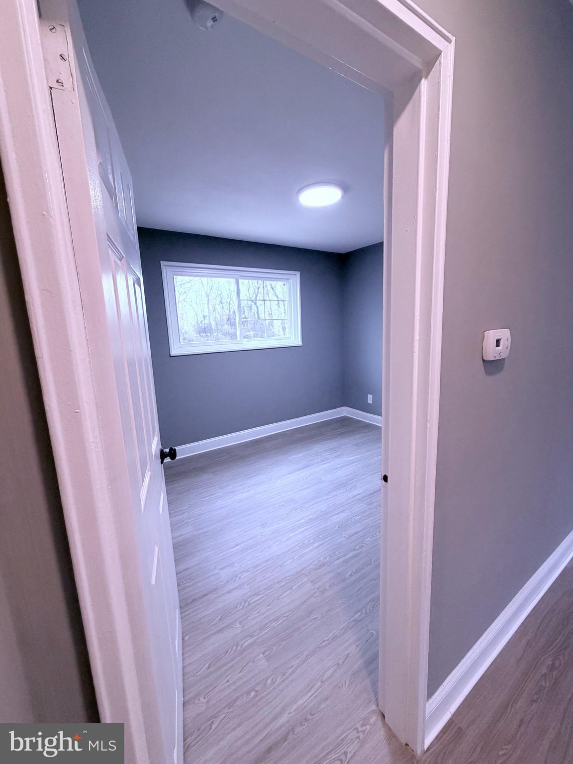 3507 Riviera Street Temple Hills, MD 20748 - Photo 5 of 16 a view of an empty room with a window
