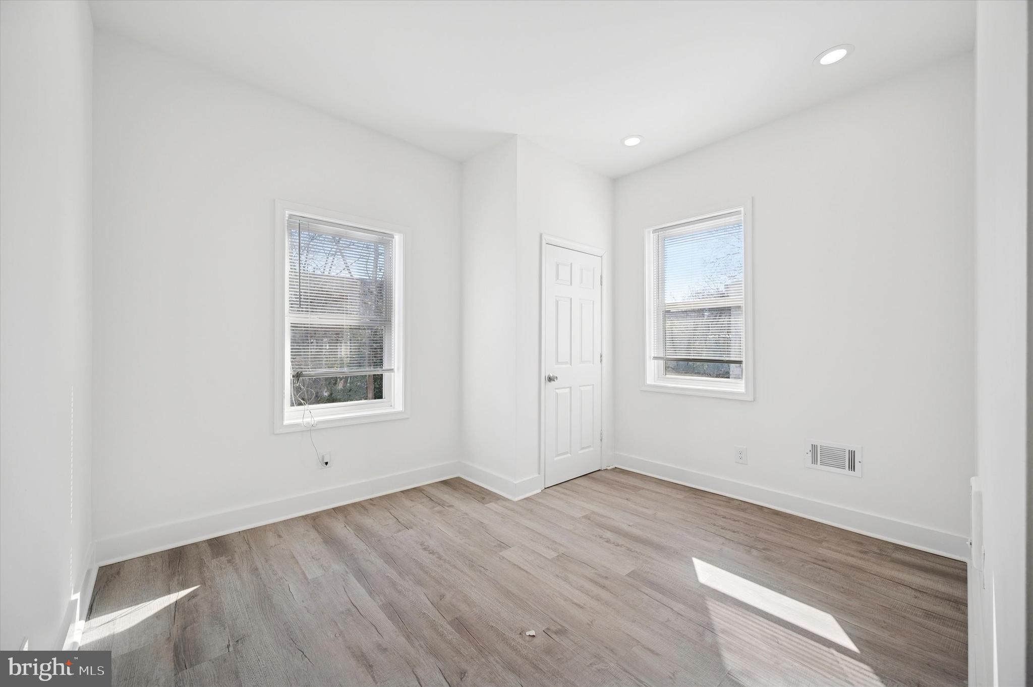 2135 North 20th Street Philadelphia, PA 19121 - Photo 12 of 20 an empty room with wooden floor and windows