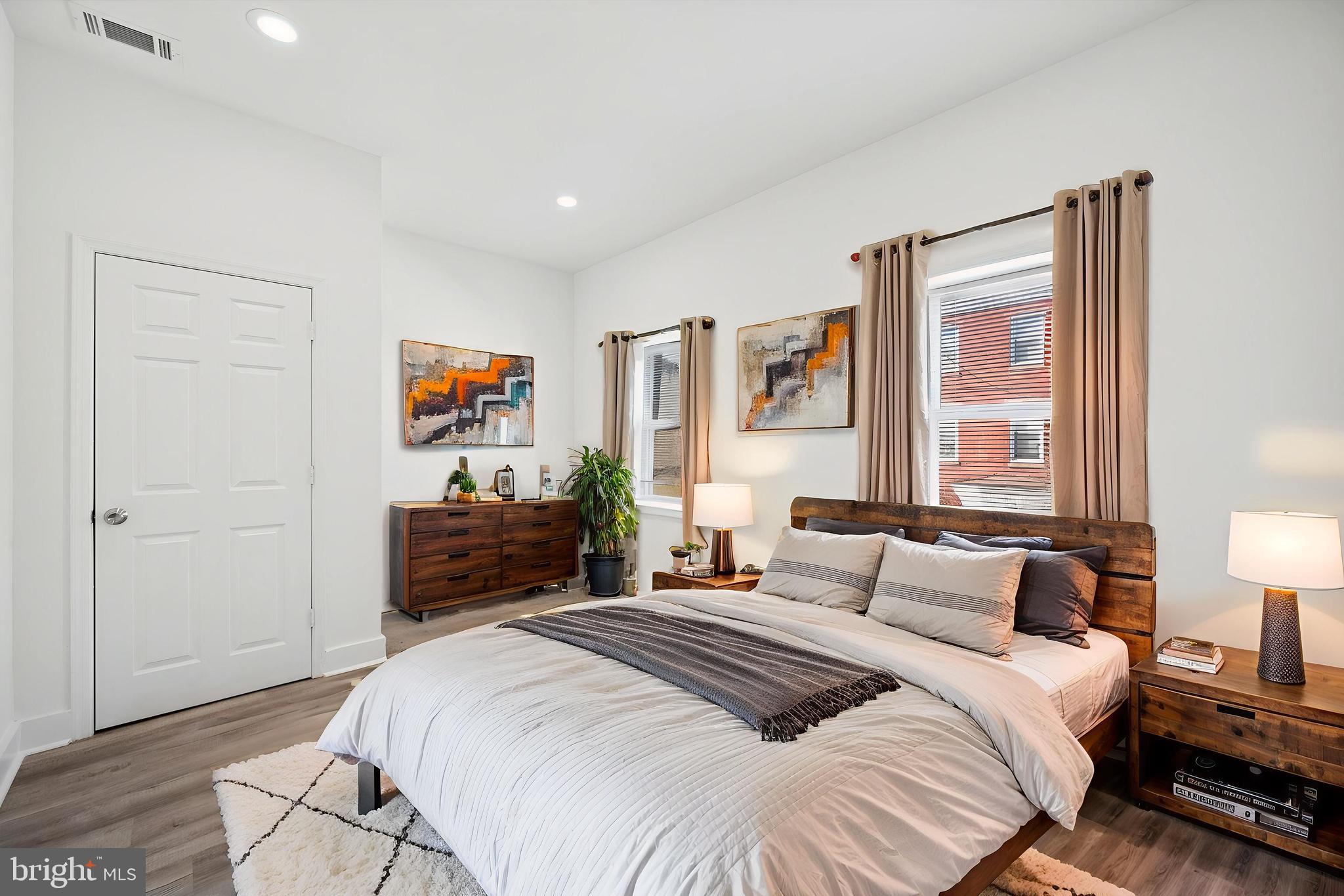 2135 North 20th Street Philadelphia, PA 19121 - Photo 14 of 20 a bedroom with a bed and wooden floor