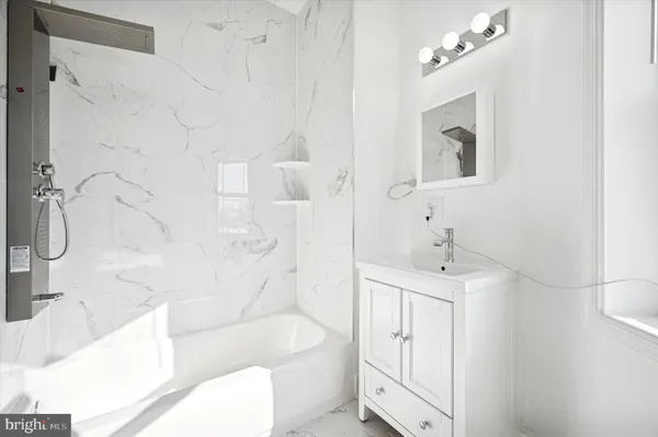 a bathroom with a bathtub sink and toilet