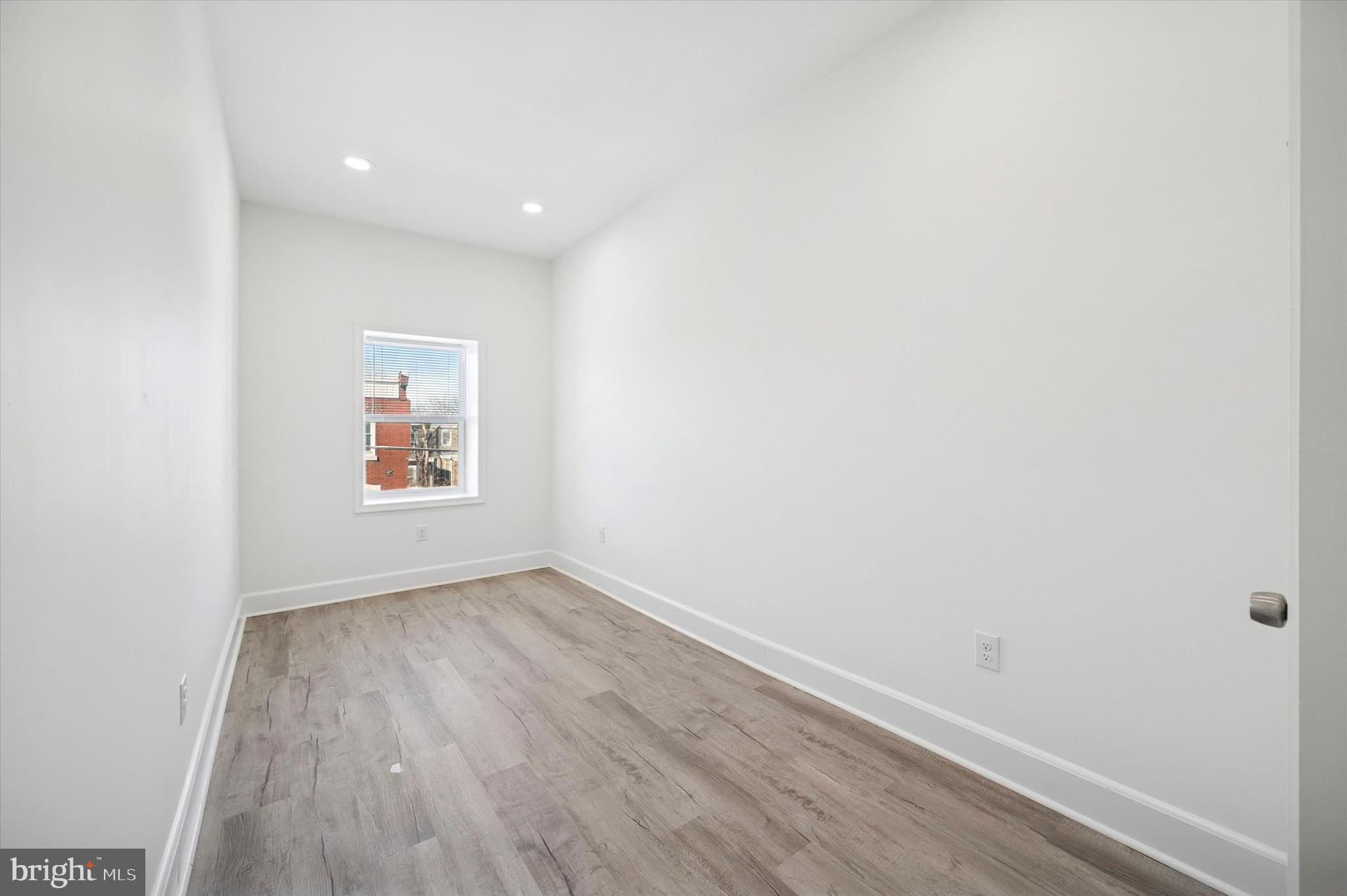 2135 North 20th Street Philadelphia, PA 19121 - Photo 18 of 20 a view of an empty room and wooden floor