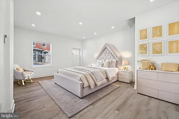 a bedroom with a large bed and a couch