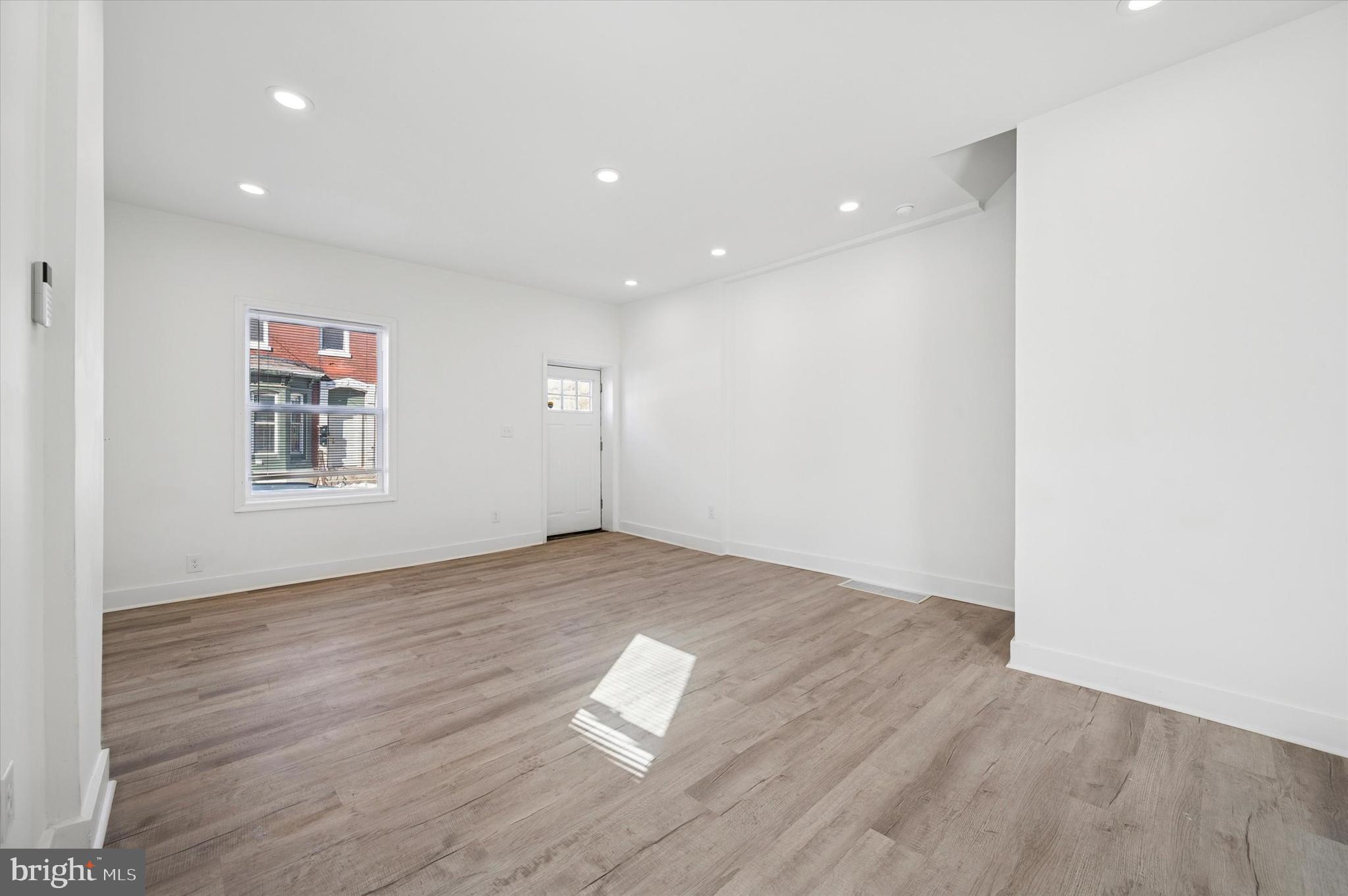 2135 North 20th Street Philadelphia, PA 19121 - Photo 7 of 20 a view of empty room with wooden floor and fan