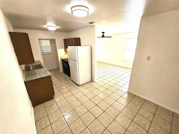 a view of a kitchen from a window