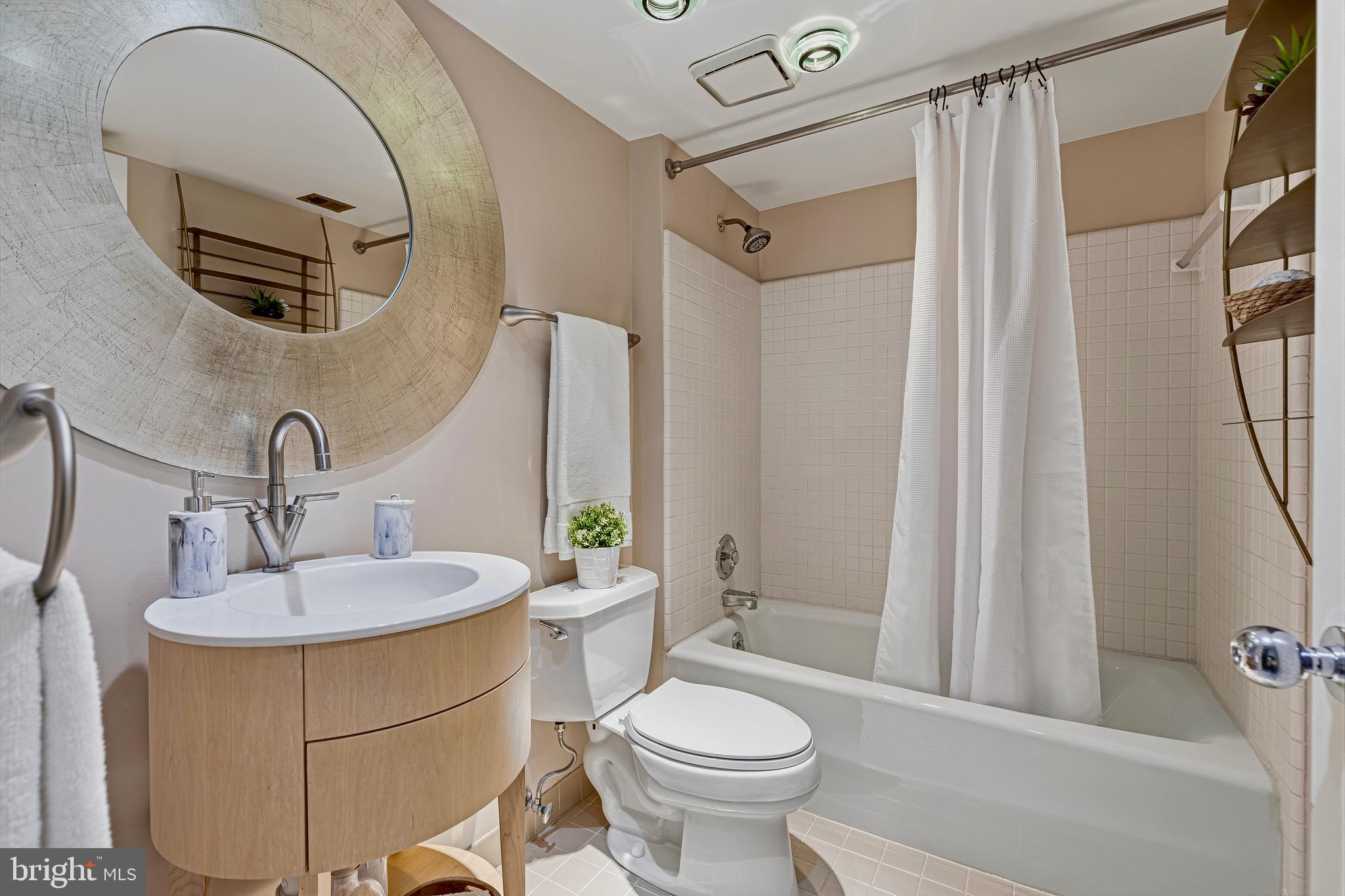 5196 27th Street Northwest Washington, DC 20008 - Photo 36 of 68 a bathroom with a sink a toilet and shower