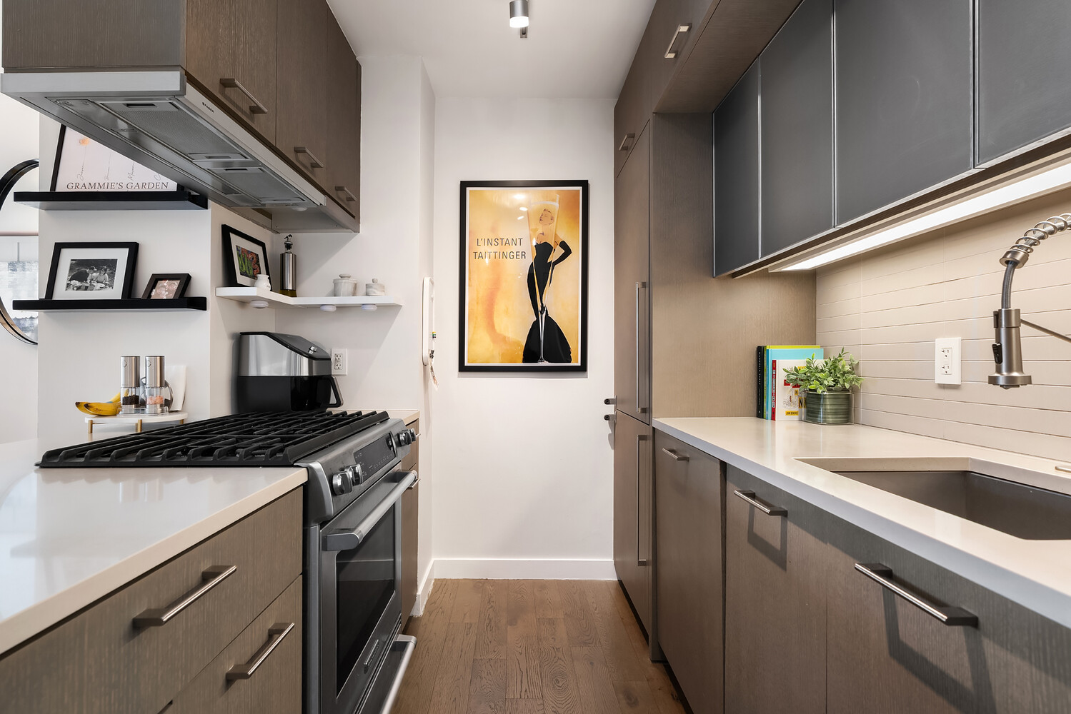 225 Rector Place, Unit 9B Manhattan, NY 10280 - Photo 5 of 14 a kitchen with stainless steel appliances granite countertop a sink stove and cabinets