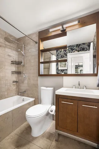 a bathroom with a toilet a sink and a bathtub