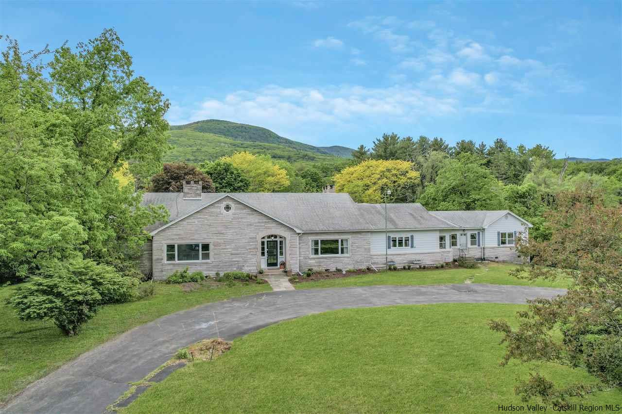 295 Game Farm Road Catskill, NY 12414 - Photo 1 of 35 a aerial view of a house with swimming pool and garden