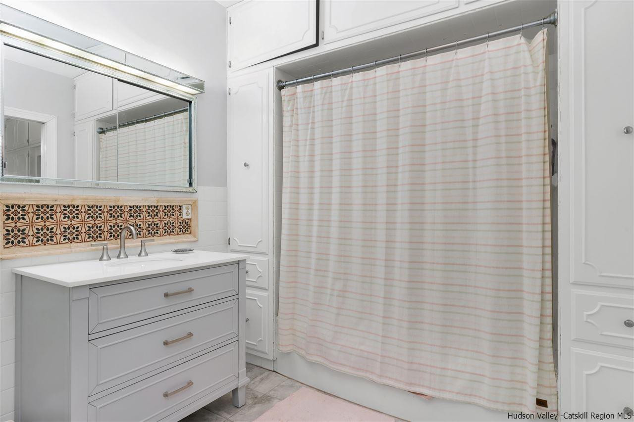 295 Game Farm Road Catskill, NY 12414 - Photo 20 of 35 a bathroom with a sink and a mirror