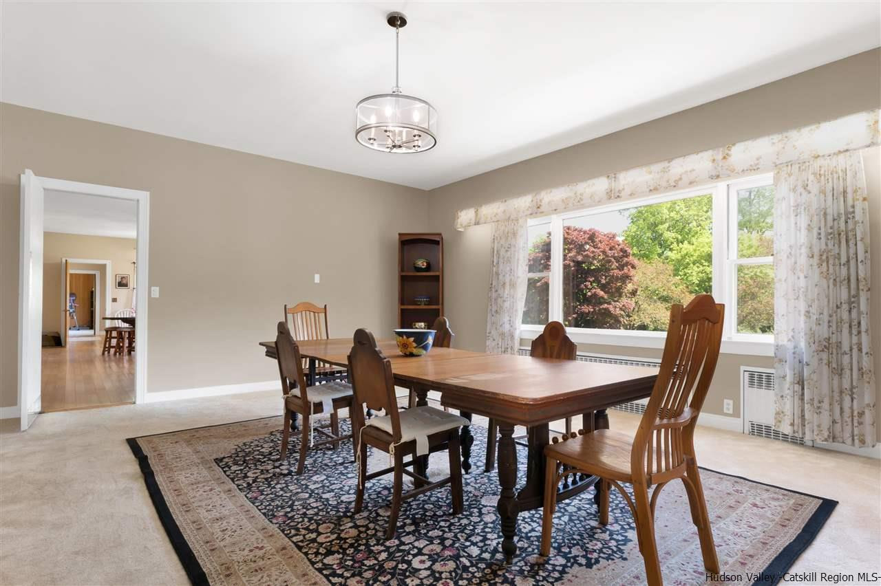 295 Game Farm Road Catskill, NY 12414 - Photo 10 of 35 a view of a dining room with furniture window and wooden floor