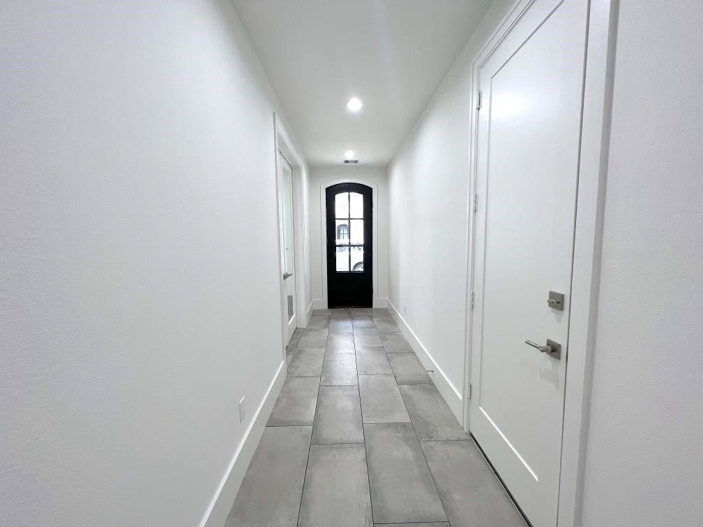 2122 Blalock Road, Unit B Houston, TX 77080 - Photo 2 of 45 a view of a hallway with wooden floor