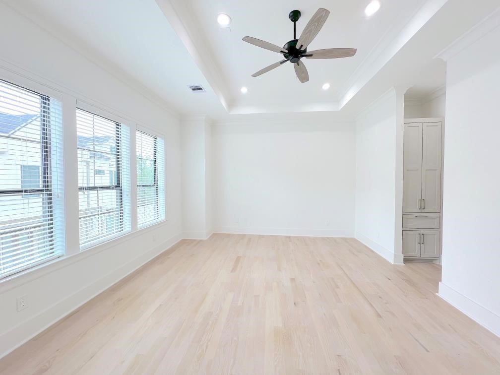 2122 Blalock Road, Unit B Houston, TX 77080 - Photo 27 of 45 a view of an empty room with a window and a ceiling fan