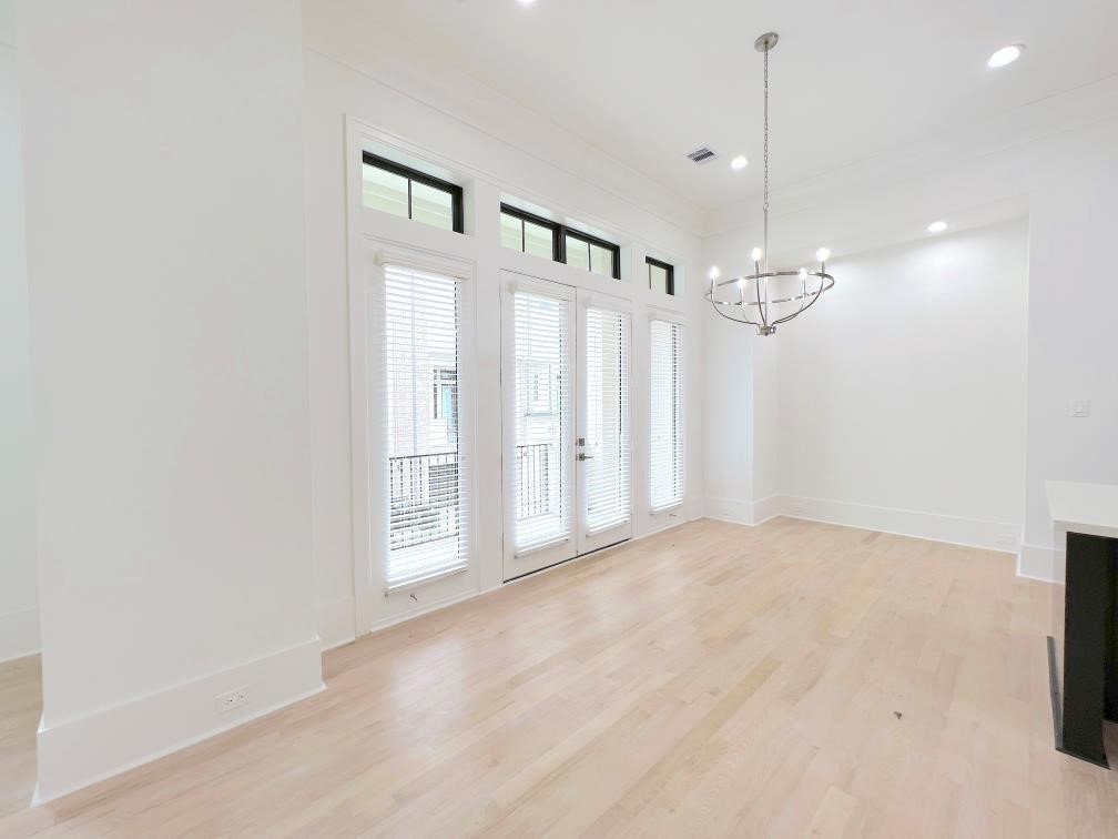 2122 Blalock Road, Unit B Houston, TX 77080 - Photo 36 of 45 a view of an empty room with chandelier and a window