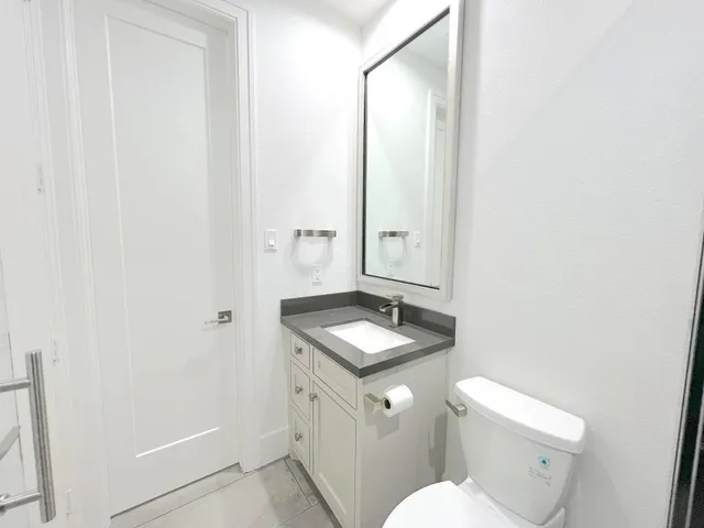 a view of a back yard from a corridor