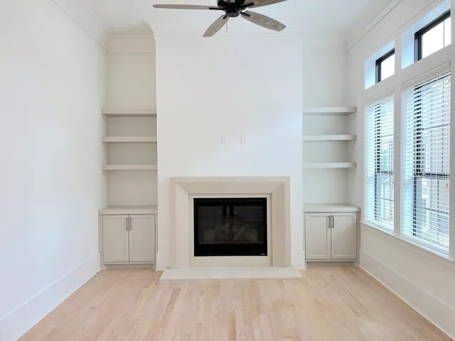 a living room with a fireplace and a window