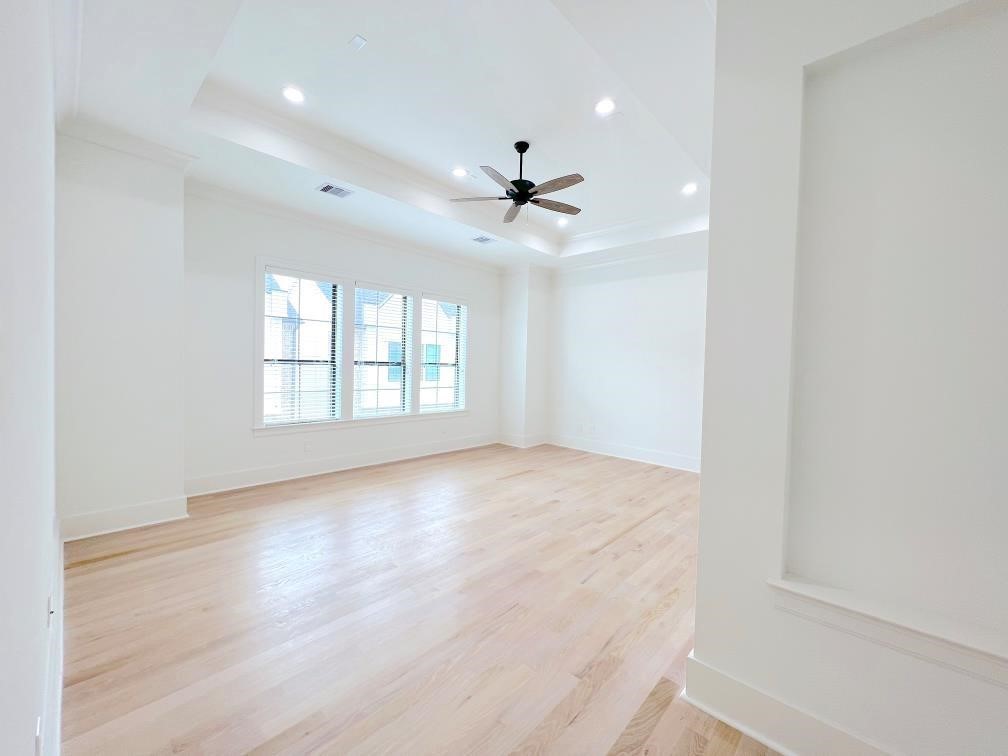 2122 Blalock Road, Unit B Houston, TX 77080 - Photo 8 of 45 wooden floor in an empty room with a window
